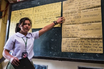 Student presenting homework on blackboard, | Free Photo - rawpixel