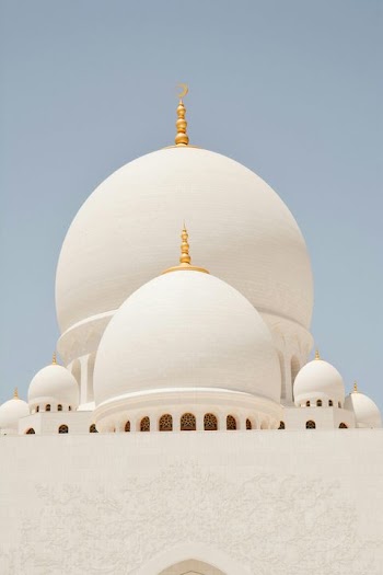 Stunning Detail of Mosque Domes Against Clear Sky