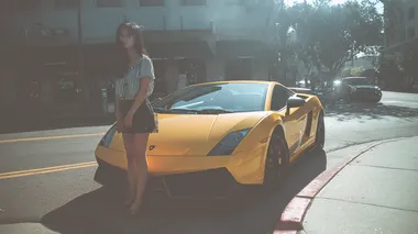 Stylish East Asian Woman with Yellow Lamborghini