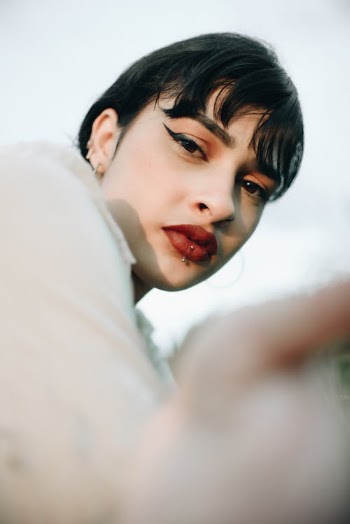 Stylish ethnic woman with makeup in nature · Free Stock Photo