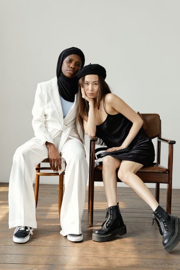 Stylish Women Sitting on Chairs · Free Stock Photo