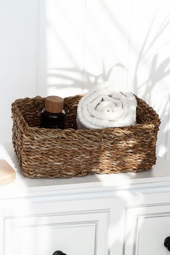 Stylish Woven Basket with Towels and Spa Products