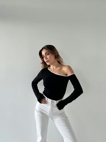 Stylish Young Woman in Black and White Outfit
