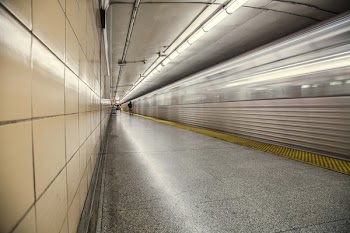 Subway Rushes Through Tunnel