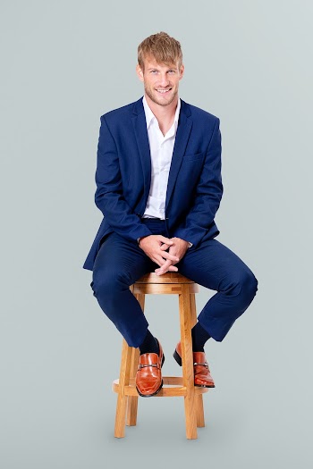 Successful businessman sitting on a wooden… | Free stock photo | High Resolution image