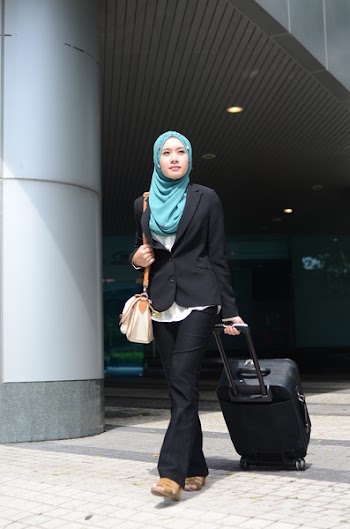 Successful businesswomen travellers waiting for their flight at airport