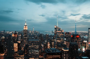 Summiting the Rockefeller Centre in NYC is expensive, but if you wait till it gets dark and if you're lucky with the weather, you can get some amazing shots at night. No helicopter needed.