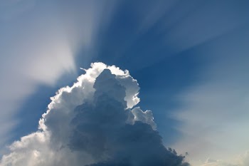 Sun Covered by White Clouds Showing