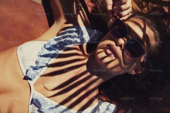 Sunbathing Under Palm Tree