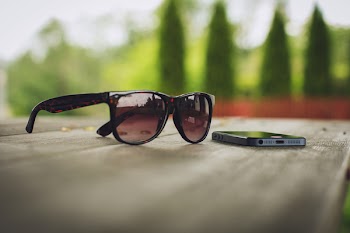 Sunglasses and phone on the table