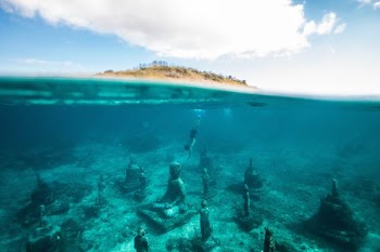Sunken Buddha statue underwater