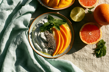 Sunlit Tropical Breakfast Scene with Yogurt and Fresh Fruit