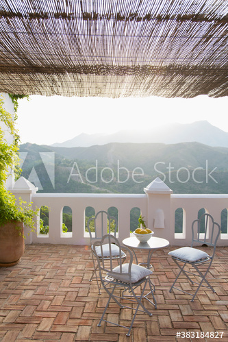 Sunny idyllic balcony overlooking mountain