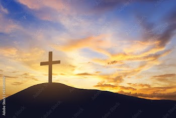 sunrise and cross on mountain