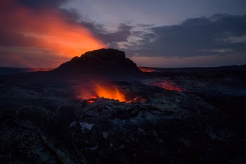 Sunset inside the Nymuragira crater, with hot vent in front of a hot plume from a lava lake (hidden by the hornito).