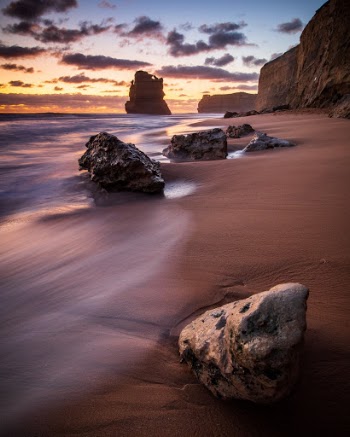 Sunset near Gibson Steps at Twelve Apostles Marine National Park in Australia.Had a great time driving the Great Ocean Road in Australia. Watching the sun set along the shore at Twelve Apostles was one of my favorite things, the ocean never ceases to amaze! 