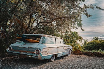 Surfboards Inside Vintage Light Blue Station Wagon
