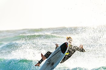 Surfer Wiping Out of his Surfboard