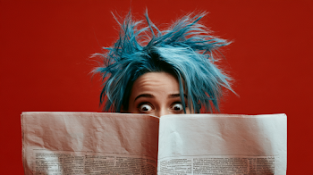 Surprised Woman Behind a Newspaper