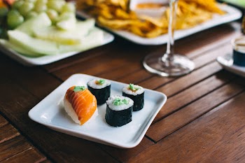 Sushi nigiri and maki with wasabi on a summer party 