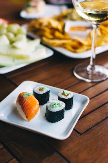 Sushi nigiri and maki with wasabi on a summer party 