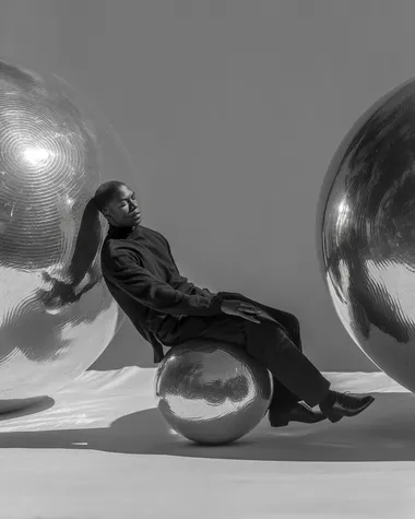 Suspended Serenity: A Surreal Embrace Between Metallic Spheres Suspended Serenity: A Surreal Embrace Between Metallic Spheres