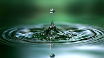 Suspended Water Droplet Above Splash Spike