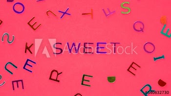 Sweet spelled word with alphabets background
