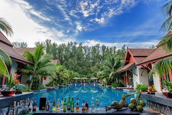 Swimming Pool Beside Houses and Trees