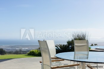 Table and chairs on sunny luxury patio