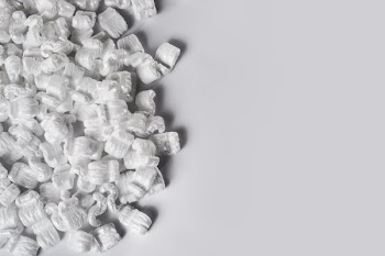 Table Half Filled With Packing Peanuts