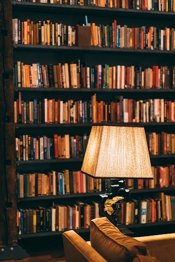 Table Lamp Near Bookshelves