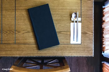 Table with a menu and silverware | Free stock photo - 449424