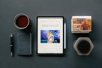 Tablet Near A Notebook