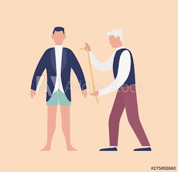 Tailor measuring cute young man in tuxedo or groom with tape measure and fitting