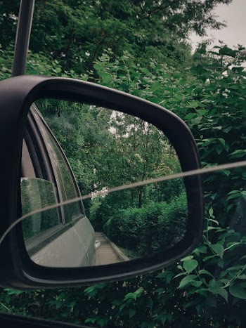 Taking Photo Using Black Vehicle Side Mirror