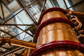 Tall Bronze Barrel Below Skylight