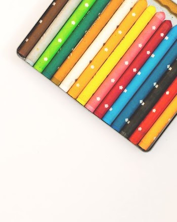 Tall colorful chalk marked with white arrows.