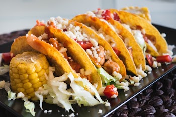 Tasty chicken tacos with cheese 
