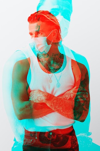 Tattooed man wearing a face mask in the new normal
