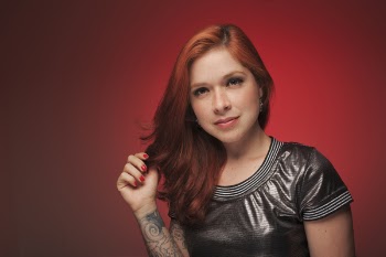 Tattooed Woman Smiling for Photo