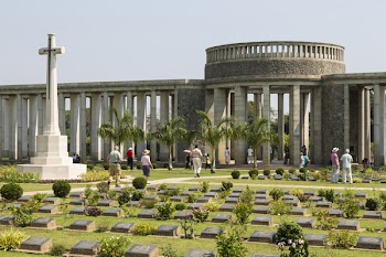 TAUKKYAN, YANGON/MYANMAR - FEBRUARY 07, 2015: Unidentified people visit Taukkyan war cemetery near Yangon. The cemetery contains the graves of 6,374 soldiers who died in the Second World War.