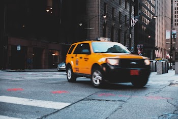 Taxi Making A Turn at the City