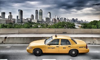 Taxi Passing Through The City