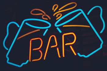 teal and orange bar neon sign