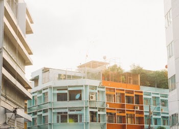 Teal Concrete Building Near Trees