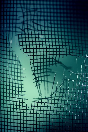 Teal damaged mesh screen wallpaper.
