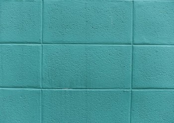 teal painted concrete wall