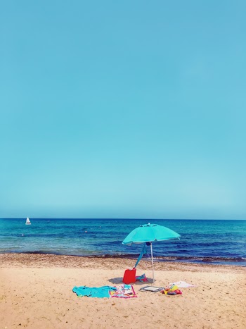 Teal Parasol At The Shore