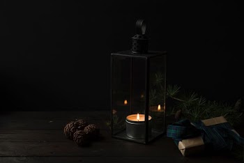 tealight candle with rack inside glass lantern
